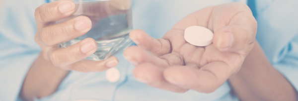 Man holding out hand with effervescent tablet