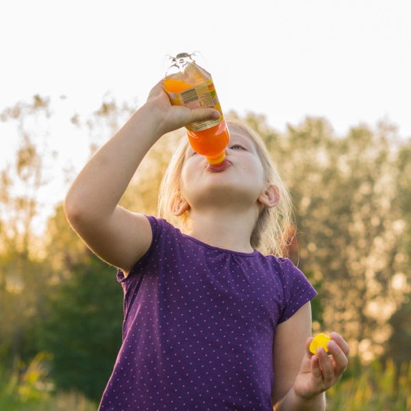 Girl drinking orange juice