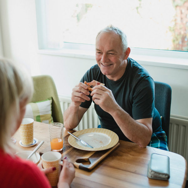 Senior couple eating breakfast